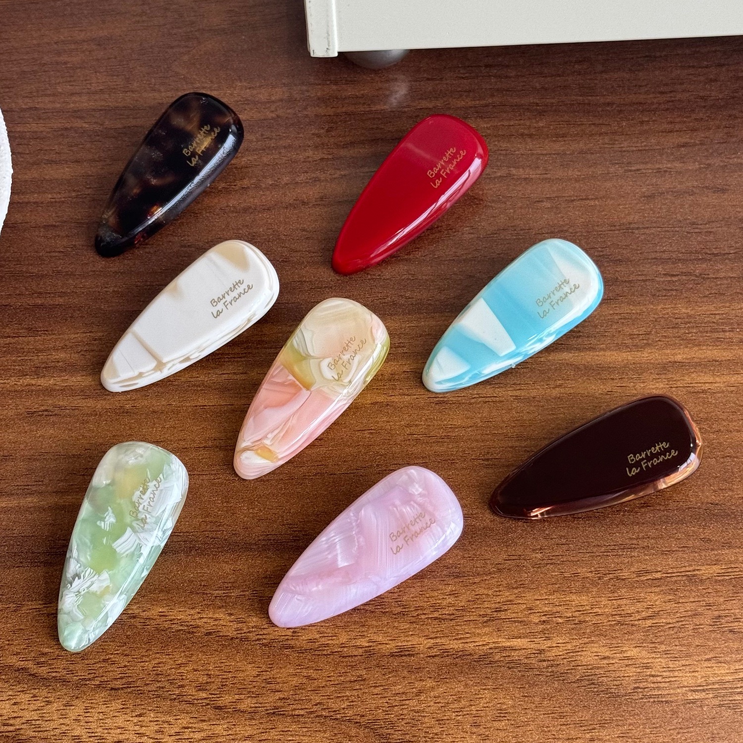 Eight colorful teardrop side clips